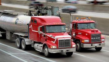 Trucks drive along Interstate Highway 90 in Chicago.