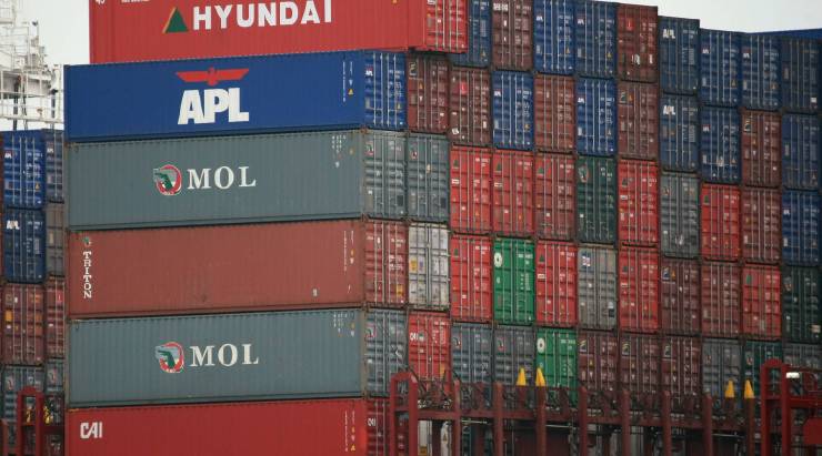 Cargo containers are stacked on a shipdocked at the Port of Oakland in California.