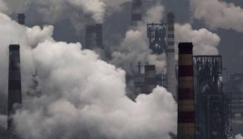 Smoke billows from smokestacks and a coal-fired generator at a steel factory in the industrial province of Hebei, China.