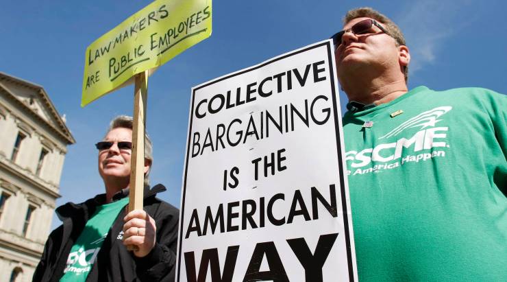 Labor union members protest Michigan Gov. Rick Snyder's proposed budget cuts in 2011.