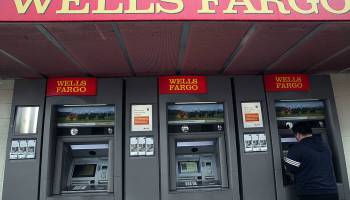 SAN FRANCISCO - JANUARY 20: A Wells Fargo customer uses an ATM at a Wells Fargo Bank branch office January 20, 2010 in San Francisco, California. Wells Fargo beat analyst expectations by posting a fourth quarter earnings of $2.82 billion or 8 cents a share compared to a loss of $2.73 billion or 84 cents a share one year ago. (Photo by Justin Sullivan/Getty Images)