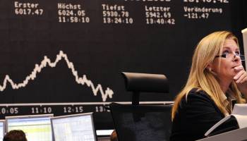 Stock brokers look at their screens at Frankfurt's stock exchange on September 16, 2008.