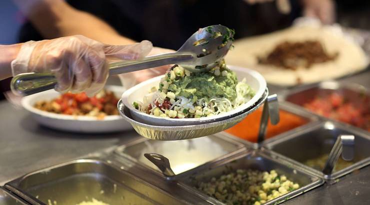 Online orders account for almost a fifth of sales at Chipotle. Above, the restaurant's workers fill orders.