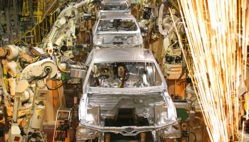 “We have the highest prices in the world right now for aluminum and steel,” said Kristin Dziczek, a vice president at the Center for Automotive Research. Above, Ford Mustangs are assembled at a plant in Flat Rock, Michigan, in 2004.