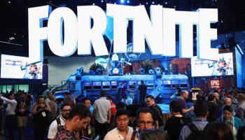 Game enthusiasts and industry personnel visit the "Fortnite" exhibit during the Electronic Entertainment Expo E3 at the Los Angeles Convention Center on June 12, 2018. 