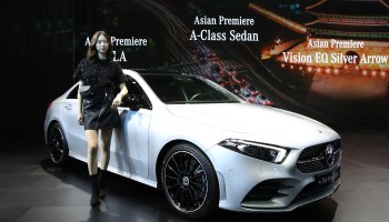 A model poses next to a Mercedes-Benz New A Class at the Seoul Motor Show 2019 at KINTEX on March 28, 2019 in Goyang, South Korea.