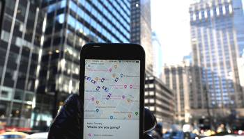 An iPhone with the Lyft ride-sharing app on it shows cars in the area on Park Avenue in New York City March 26.