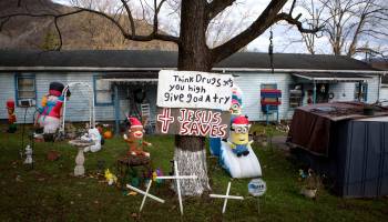 A homemade sign says "Think drugs gets you high give God a try," on a front lawn in Big Stone Gap, Virginia. The town in Wise County has been hit hard by the opioid epidemic.