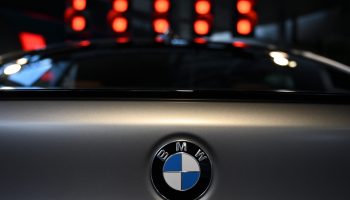 The BMW logo is pictured on a car displayed at the "BMW World" delivery center near the company's headquarters in Munich, southern Germany, on March 19, 2019.