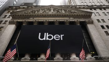 The Uber banner hangs outside of the New York Stock Exchange (NYSE) before the Opening Bell at the NYSE as the ride-hailing company Uber makes its highly anticipated initial public offering (IPO) on May 10, 2019 in New York City. Uber will start trading on the New York Stock Exchange after raising $8.1 billion in the biggest U.S. IPO in five years.Thousands of Uber and other app based drivers protested around the country on Wednesday to demand better pay and working conditions including sick leave, over time and a minimum wage.