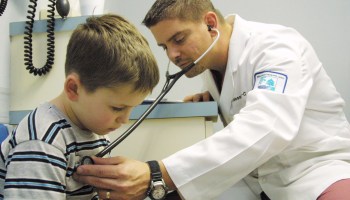 A 6-year-old boy is examined by a physician's assistant in Vivian, Louisiana.