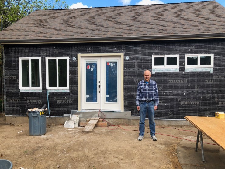 Paul Boehm stands outside the tiny home he's building in his Silicon Valley backyard. More and more seniors are turning to in-law units as a viable downsizing option as they age.