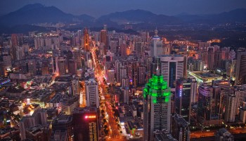 The Shenzhen skyline, including the Shenzhen World Financial Center illuminated by green lights, in 2010.