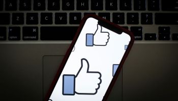 The Facebook like logo is seen on a portable mobile device