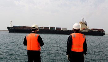 Workers at an Iranian port on the Gulf of Oman