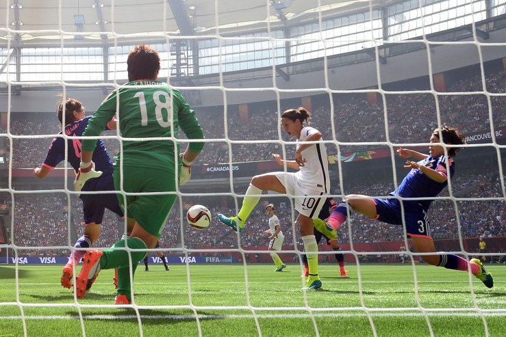 Carli Lloyd of the U.S. scores the team's second goal against Saki Kumagai #4, Azusa Iwashimizu #3 and goalkeeper Ayumi Kaihori #18 of Japan in the FIFA Women's World Cup Canada 2015 Final at BC Place Stadium on July 5, 2015 in Vancouver, Canada.