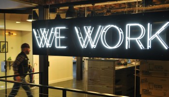 A man walks into a WeWork office in Washington, D.C.