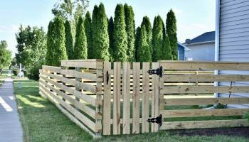 Kelsey Sprowell of Iowa City, Iowa, chose to build this fence with her family to save money.