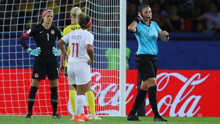 Referee Kate Jacewicz indicates she is going to use video assistant referee after awarding Sweden a penalty during a match with Canada at the Women's World Cup in Paris on June 24.