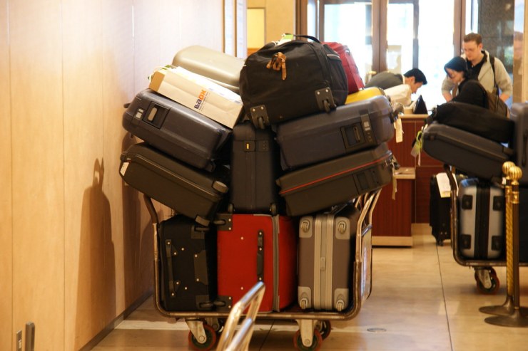 Luggage stacked on a cart.