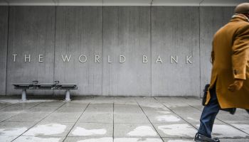 A person walks by the building of the Washington-based global development lender, The World Bank Group, in Washington