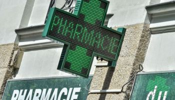 A pharmacy's green cross sign in Nantes, western France.