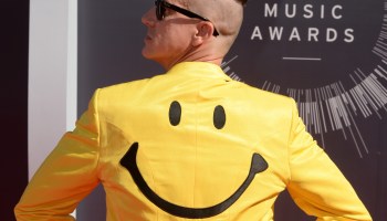 Fashion designer Jeremy Scott arrives on the red carpet wearing a smiley face suit at the MTV Video Music Awards in 2014 at the Forum in Inglewood, California.