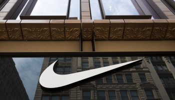The Nike swoosh logo is displayed on the outside of a Nike store in 2017 in New York City.