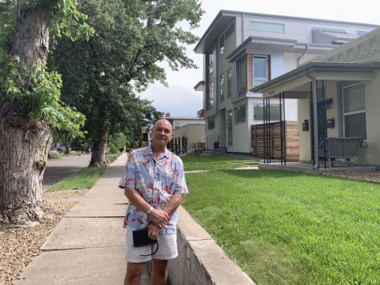 Bill Killam, a longtime resident of Denver's Berkeley neighborhood, stands on one of many blocks where large, boxy duplexes are replacing single-story homes.