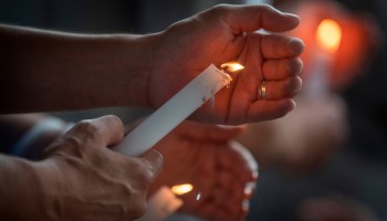 People light candles during a vigil after the shooting at the Cielo Vista Mall Walmart in El Paso, Texas, on Aug. 4.