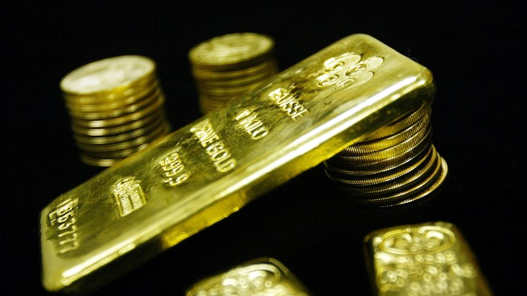 Gold bullion bars and coins for sale at Manfra, Tordella & Brookes Inc. in 2003 in New York City.