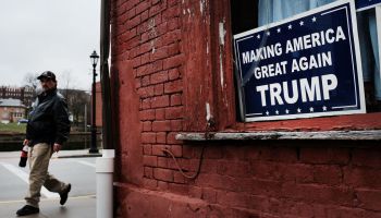 A Donald Trump sign hangs in the window in the town of Waynesburg, Pennsylvania, near the West Virginia border in 2018.