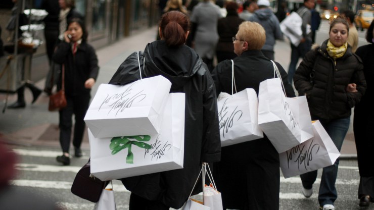 Shoppers carry bags on Fifth Avenue in New York City.