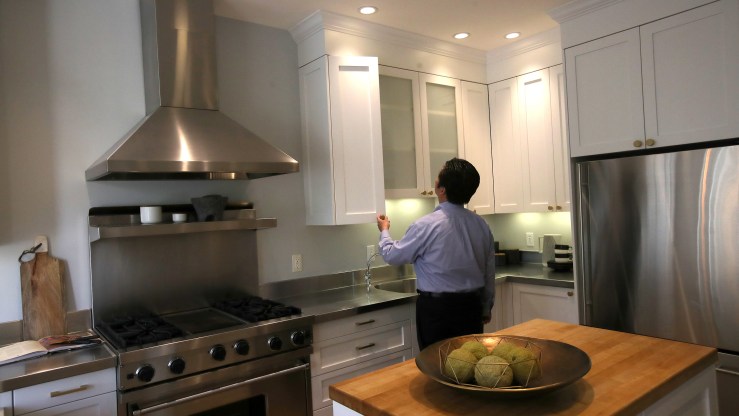 A real estate agent tours a home for sale during a broker open house in San Francisco in April.