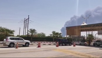 This AFPTV screen grab from a video made on September 14, 2019, shows smoke billowing from an Aramco oil facility in Abqaiq about 60km (37 miles) southwest of Dhahran in Saudi Arabia's eastern province.