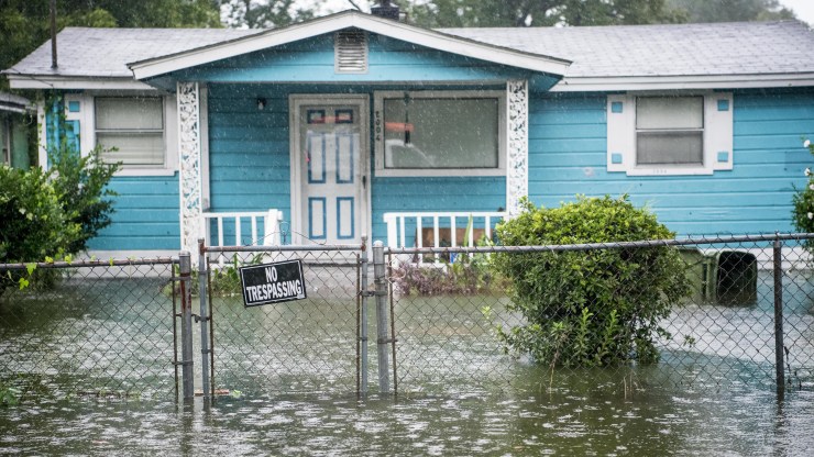 Flood water accumulates in the front yard of a home in Georgetown, South Carolina, on Sept. 5.