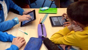 Pupils use tablets during class at the Leonard de Vinci middle school in Saint-Brieuc, France, in 2013.