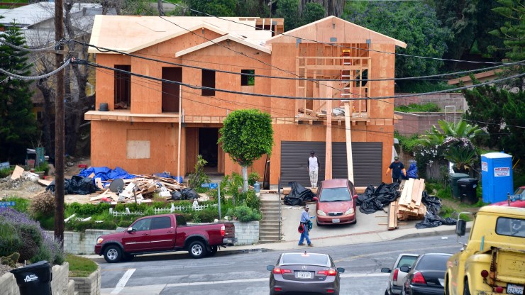 A construction crew works on a new house in Monterey Park, California, in March.