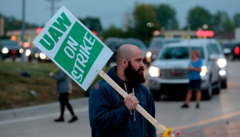 Members of the United Automobile Workers who are employed at the General Motors Co. Flint Assembly plant in Flint, Michigan, slow down salaried employees entering the plant as they strike early on Sept. 16.