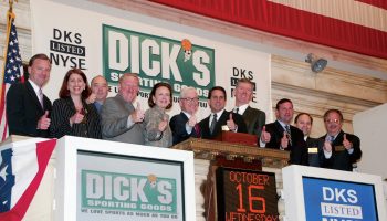 Ed Stack (center with glasses) and the rest of the DICK’S management team ringing the bell at the NYSE in 2002