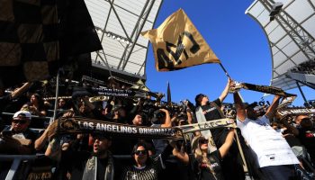 Fans of Los Angeles FC cheer during the first half of a game between the Seattle Sounders and the Los Angeles FC at Banc of California Stadium on April 21, 2019