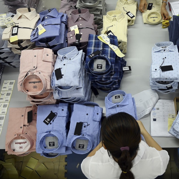 A garment factory worker packing shirts in a factory in Hanoi, Vietnam, in 2019.
