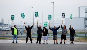 United Auto Workers members picket at the General Motors assembly plant in Flint, Michigan, in September.