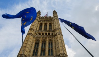 European flags are seen fluttering outside the British Houses of Parliament in Westminster.