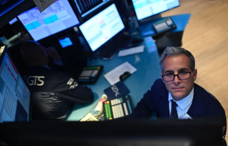 A trader works during the opening bell at the New York Stock Exchange.