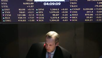 A trader exiting the floor of the New York Stock Exchange in April 2013.