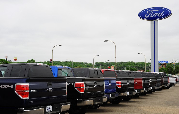 Ford F-150s are lined up at a dealership in Hudson, Wisconsin.