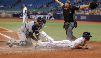 Home plate umpire Greg Gibson calls Andrew Velazquez of the Tampa Bay Rays safe in a game against the New York Yankees in St. Petersburg, Florida, in 2018. Photo by Mike Carlson/Getty Images