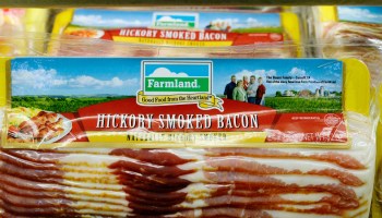 Smithfield Foods, a Chinese-owned company, is warning of a pork shortage. Smithfield owns the Farmland brand, shown above at a supermarket in Los Angeles in 2013.