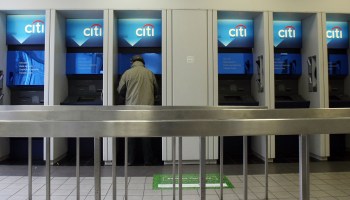 A man uses an ATM at a Citibank branch in New York City. ATM fees are at an all-time high, according to Bankrate.